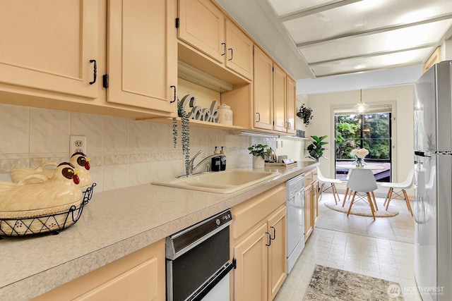 1541 NE 143rd St Unit H5, Seattle, WA 98125 - kitchen with tasteful backsplash, dishwashing machine, light countertops, and freestanding refrigerator