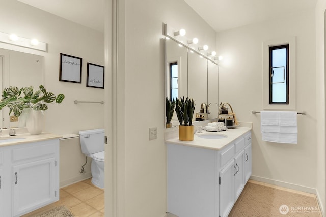 1541 NE 143rd St Unit H5, Seattle, WA 98125 - bathroom featuring two vanities and tile patterned floors