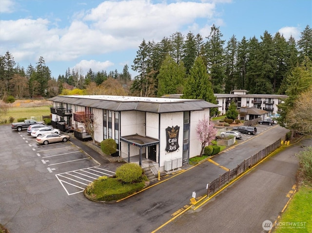 19411 56th Ave W Unit 321, Lynnwood, WA 98036 - view of property featuring uncovered parking