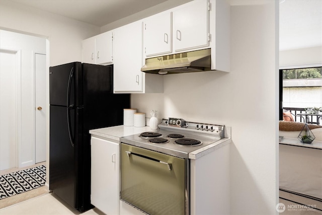 19411 56th Ave W Unit 321, Lynnwood, WA 98036 - kitchen with under cabinet range hood, a baseboard radiator, electric stove, light countertops, and white cabinetry