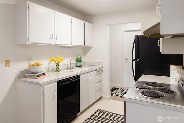 19411 56th Ave W Unit 321, Lynnwood, WA 98036 - kitchen featuring black appliances, light countertops, and white cabinets
