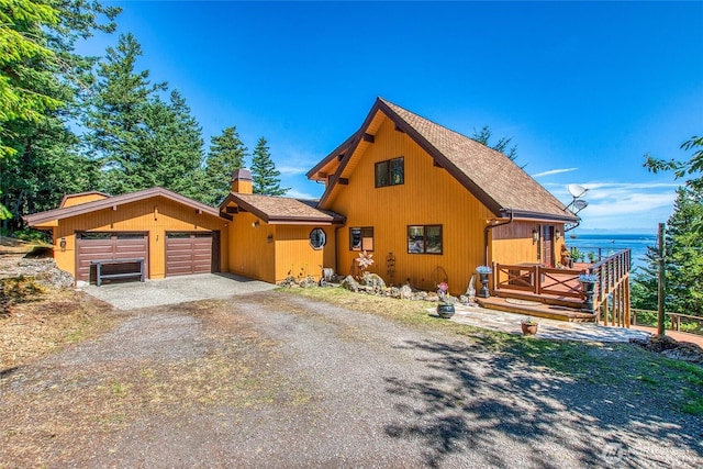 1669 Day Lake Rd, Orcas Island, WA 98245 - rustic home featuring driveway, a shingled roof, and a garage