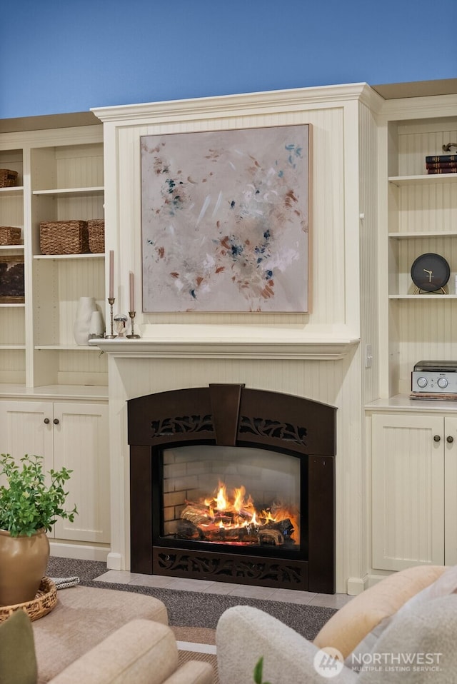 490 E Mountain View Dr, Allyn, WA 98524 - detailed view of a lit fireplace and built in shelves