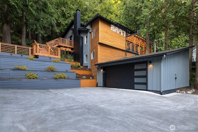 13 Westbrook Ct, Bellingham, WA 98229 - view of property exterior with a chimney and driveway