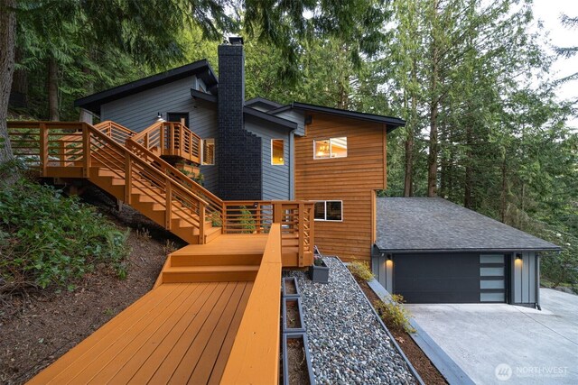 13 Westbrook Ct, Bellingham, WA 98229 - rear view of property with stairway, a chimney, a wooden deck, and concrete driveway