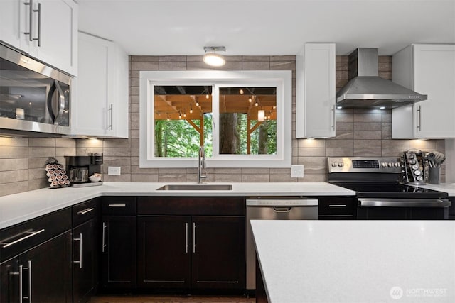 13 Westbrook Ct, Bellingham, WA 98229 - kitchen with wall chimney range hood, stainless steel appliances, light countertops, and white cabinets