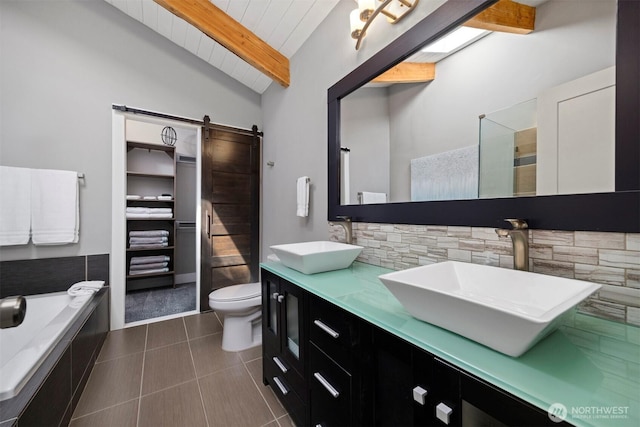 13 Westbrook Ct, Bellingham, WA 98229 - bathroom featuring double vanity, wooden ceiling, tiled tub, and tile patterned floors