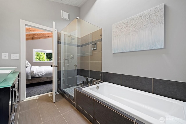 13 Westbrook Ct, Bellingham, WA 98229 - ensuite bathroom featuring a stall shower, vanity, a garden tub, and vaulted ceiling