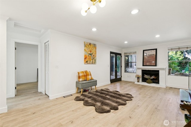 13216 NE 138th Pl, Kirkland, WA 98034 - sitting room featuring crown molding, recessed lighting, wood finished floors, and a fireplace with raised hearth