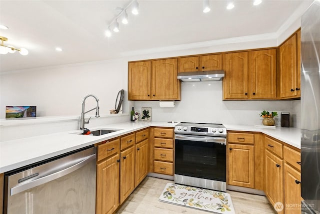 13216 NE 138th Pl, Kirkland, WA 98034 - kitchen featuring stainless steel appliances, under cabinet range hood, crown molding, light countertops, and brown cabinetry