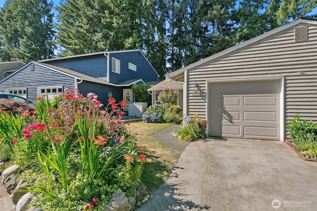 13216 NE 138th Pl, Kirkland, WA 98034 - view of front of house with asphalt driveway and an attached garage
