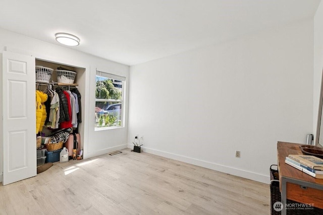 13216 NE 138th Pl, Kirkland, WA 98034 - bedroom featuring light wood finished floors and a closet