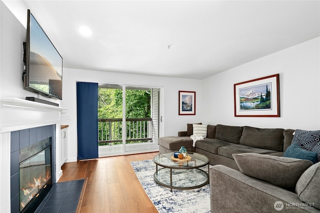 23335 Cedar Way Unit B204, Mountlake Terrace, WA 98043 - living area with hardwood / wood-style floors, a tile fireplace, and recessed lighting