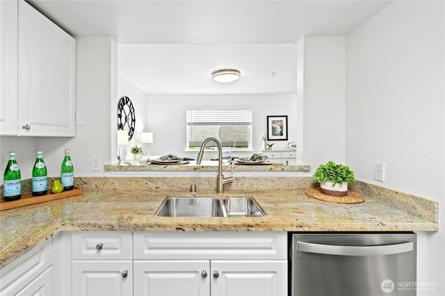 23335 Cedar Way Unit B204, Mountlake Terrace, WA 98043 - kitchen featuring stainless steel dishwasher, white cabinets, and light stone countertops