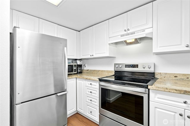 23335 Cedar Way Unit B204, Mountlake Terrace, WA 98043 - kitchen with appliances with stainless steel finishes, under cabinet range hood, white cabinetry, light wood-style flooring, and light stone countertops