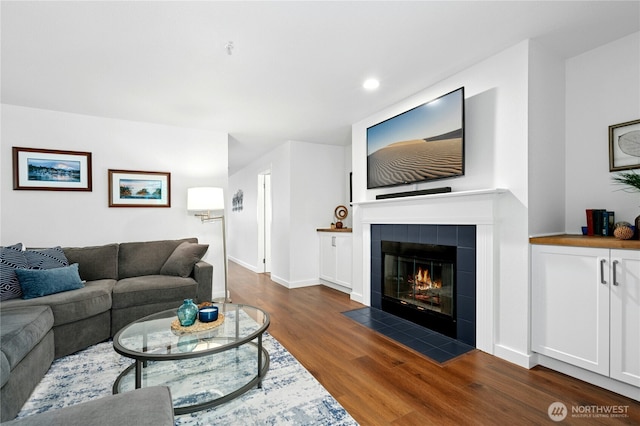 23335 Cedar Way Unit B204, Mountlake Terrace, WA 98043 - living area featuring wood finished floors, a tile fireplace, and recessed lighting