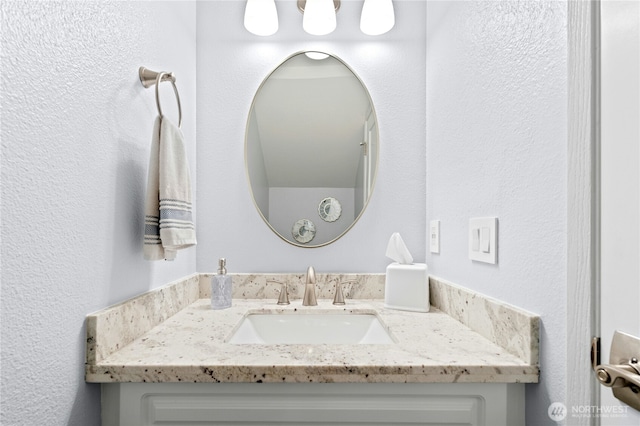 23335 Cedar Way Unit B204, Mountlake Terrace, WA 98043 - bathroom featuring vanity and a textured wall