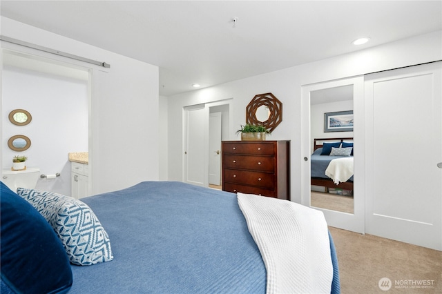 23335 Cedar Way Unit B204, Mountlake Terrace, WA 98043 - bedroom with light colored carpet, recessed lighting, and multiple closets
