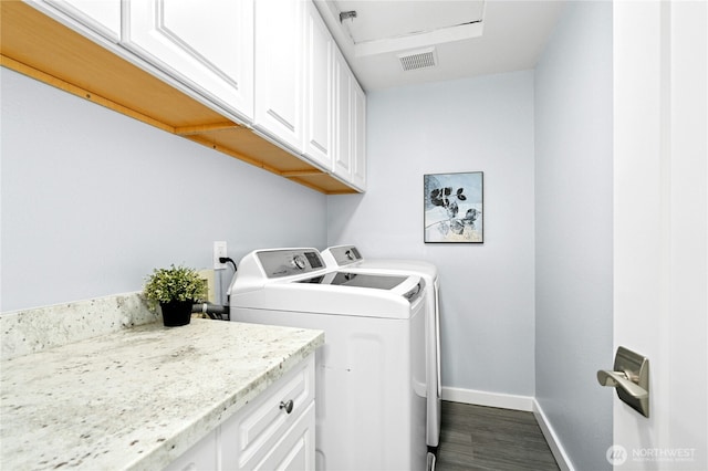 23335 Cedar Way Unit B204, Mountlake Terrace, WA 98043 - laundry area featuring cabinet space, washer and dryer, and dark wood-style flooring