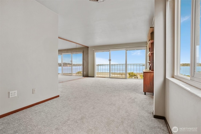 1156 Alki Ave SW Unit 202, Seattle, WA 98116 - spare room with plenty of natural light, carpet, and a water view