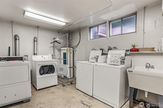 1156 Alki Ave SW Unit 202, Seattle, WA 98116 - washroom featuring washing machine and dryer and water heater