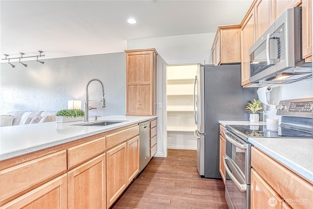 1601 Maiden Ln Unit A102, Wenatchee, WA 98801 - kitchen with appliances with stainless steel finishes, light brown cabinets, wood finished floors, and recessed lighting