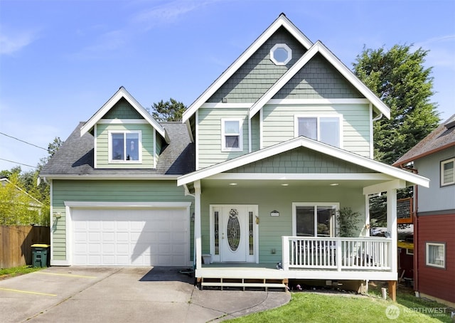 1121 22nd St, Bellingham, WA 98225 - view of front of property with a porch, concrete driveway, and a shingled roof