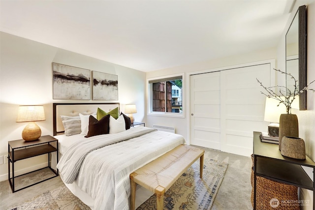 8941 Ravenna Ave NE, Seattle, WA 98115 - bedroom with carpet flooring, a closet, and a baseboard heating unit