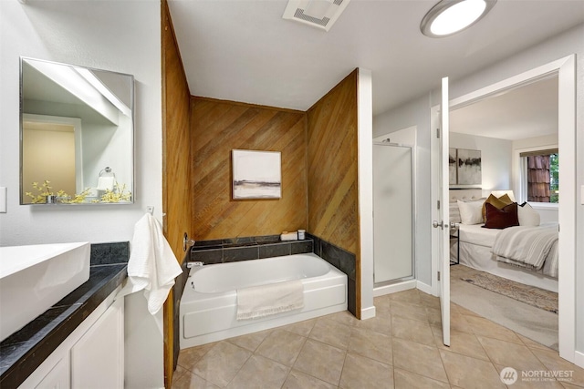 8941 Ravenna Ave NE, Seattle, WA 98115 - bathroom featuring ensuite bath, vanity, a garden tub, a stall shower, and wooden walls