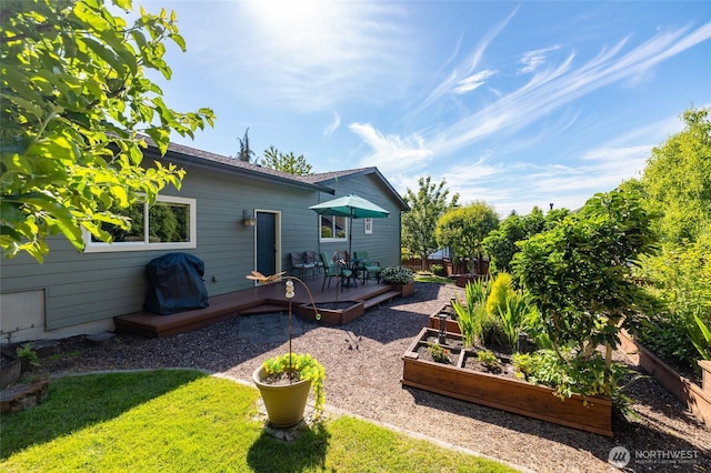 3205 Shelly Hill Rd, Mount Vernon, WA 98274 - view of green lawn with a vegetable garden and a wooden deck