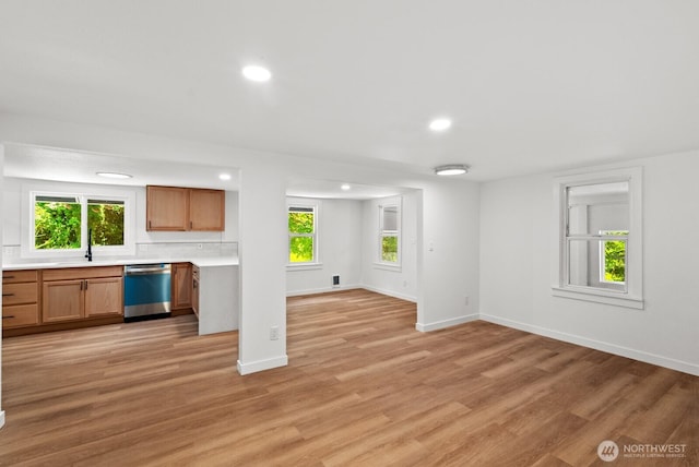 608 NE 2nd St, Winlock, WA 98596 - unfurnished living room with recessed lighting, light wood finished floors, and plenty of natural light