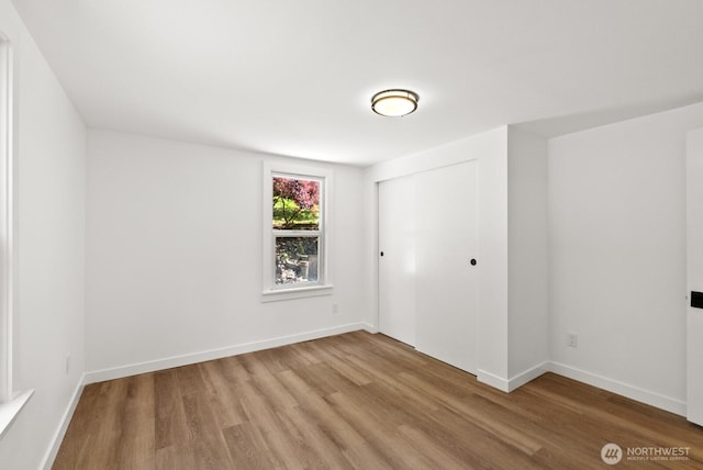 608 NE 2nd St, Winlock, WA 98596 - unfurnished bedroom featuring light wood finished floors and a closet