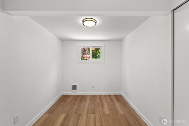 608 NE 2nd St, Winlock, WA 98596 - spare room featuring wood finished floors and baseboards