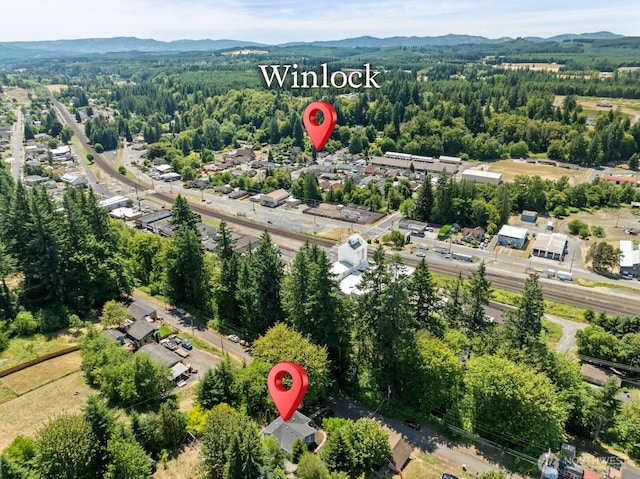 608 NE 2nd St, Winlock, WA 98596 - aerial overview of property's location with a mountainous background