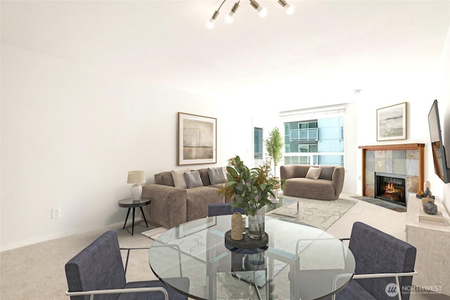 10501 8th Ave NE Unit 334, Seattle, WA 98125 - carpeted dining space featuring a tiled fireplace