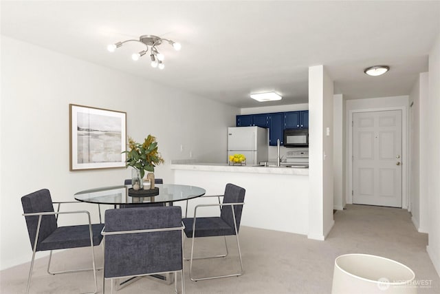 10501 8th Ave NE Unit 334, Seattle, WA 98125 - dining space featuring light colored carpet and baseboards