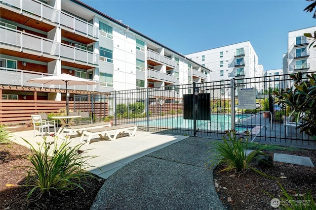 10501 8th Ave NE Unit 334, Seattle, WA 98125 - surrounding community with a pool and a patio area