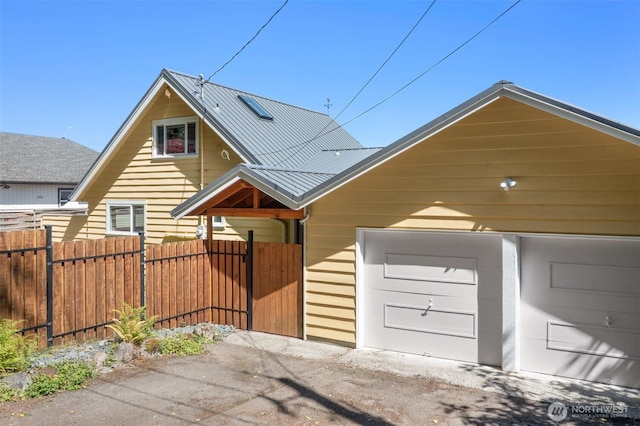 10843 Point Vashon Dr SW, Vashon, WA 98070 - view of front of house featuring a metal roof and a garage