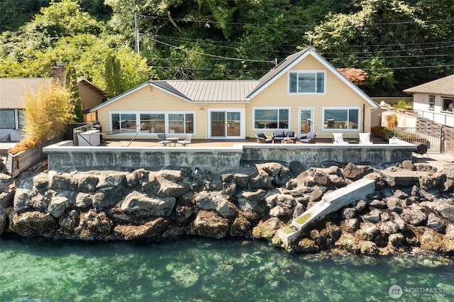 10843 Point Vashon Dr SW, Vashon, WA 98070 - back of house featuring a patio area and a metal roof