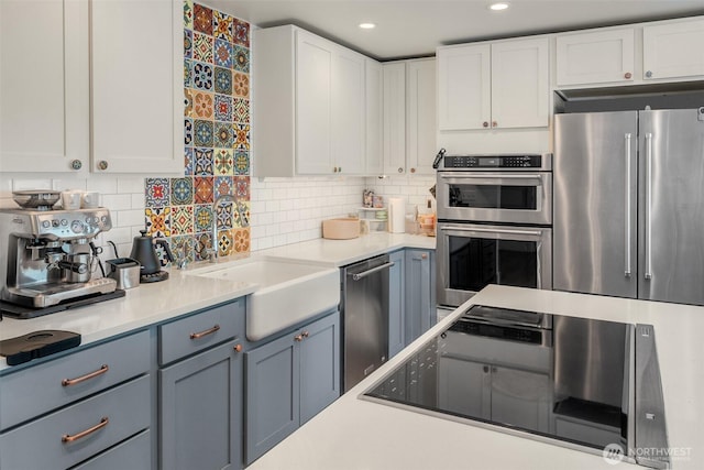 10843 Point Vashon Dr SW, Vashon, WA 98070 - kitchen with appliances with stainless steel finishes, white cabinets, light countertops, and recessed lighting