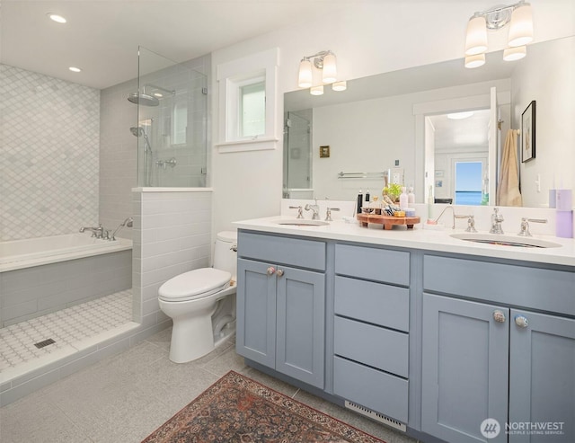 10843 Point Vashon Dr SW, Vashon, WA 98070 - bathroom with double vanity, tiled shower, tile patterned flooring, a bath, and recessed lighting