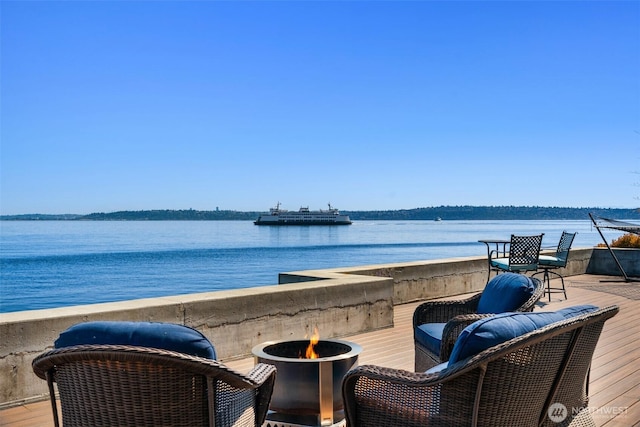 10843 Point Vashon Dr SW, Vashon, WA 98070 - wooden deck with a water view and an outdoor fire pit