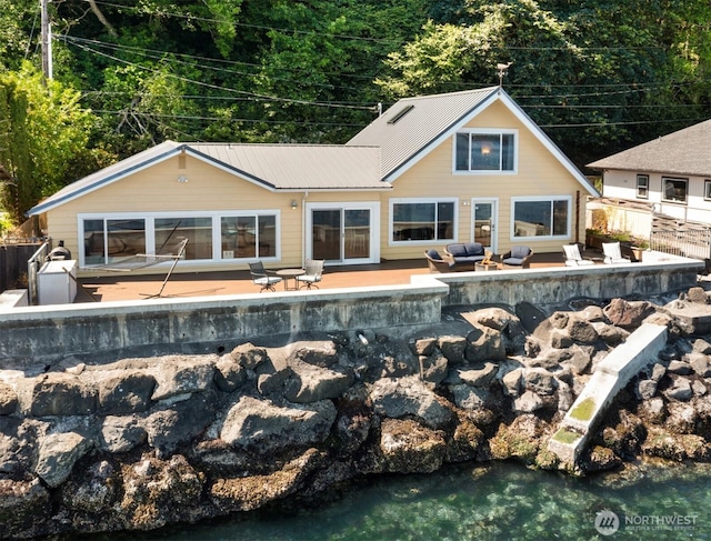 10843 Point Vashon Dr SW, Vashon, WA 98070 - back of property with a patio area, a metal roof, and an outdoor hangout area