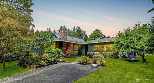 1323 216th Ave NE, Sammamish, WA 98074 - view of front of property featuring a chimney and a front yard