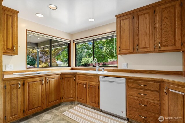 1323 216th Ave NE, Sammamish, WA 98074 - kitchen featuring white appliances, brown cabinetry, light countertops, and recessed lighting