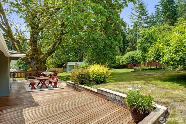 1323 216th Ave NE, Sammamish, WA 98074 - wooden deck featuring outdoor dining area and an outbuilding