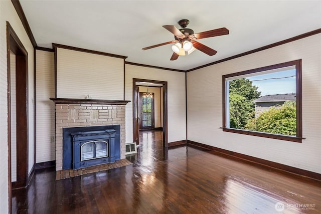 3706 Upland Ave, Everett, WA 98203 - unfurnished living room with wood finished floors, ceiling fan, crown molding, and a brick fireplace