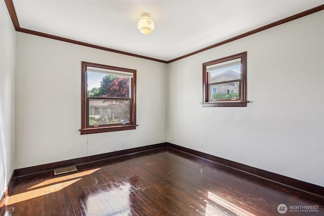 3706 Upland Ave, Everett, WA 98203 - empty room with healthy amount of natural light, dark wood-style floors, and crown molding