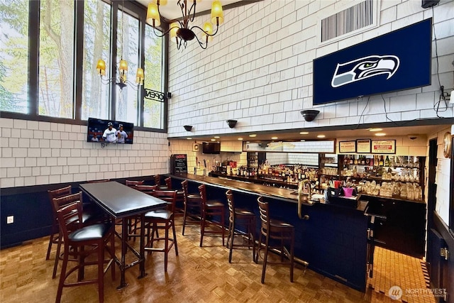 13932 NE 60th St Unit 150, Redmond, WA 98052 - indoor dry bar with a chandelier and tasteful backsplash