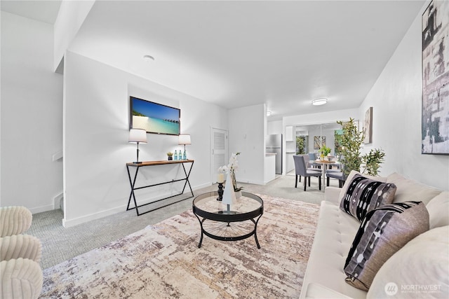 13932 NE 60th St Unit 150, Redmond, WA 98052 - living room featuring carpet and baseboards